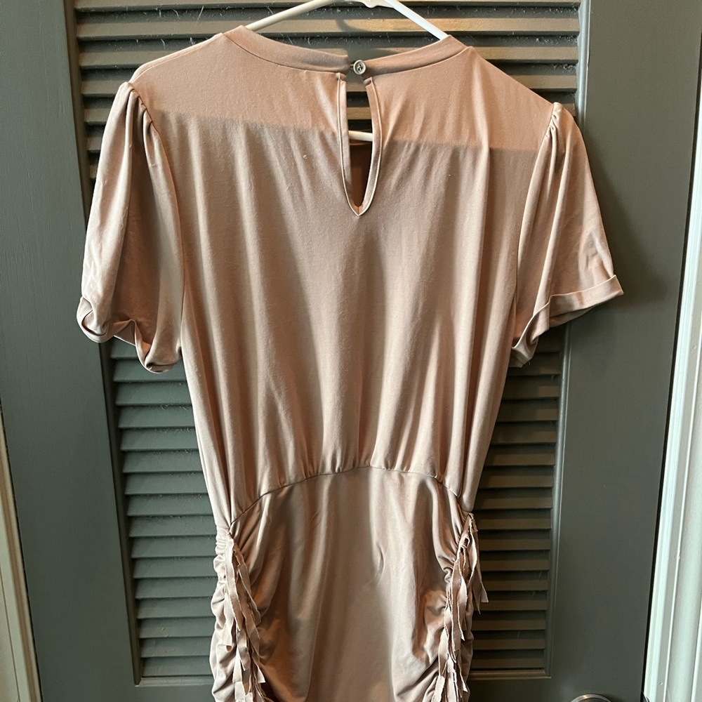 Worn once, no sign of tear or anything Kittenish